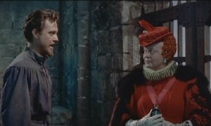 Em cena Richard Todd, como Sir Walter Raleigh, e Bette Davis como Elizabeth I.